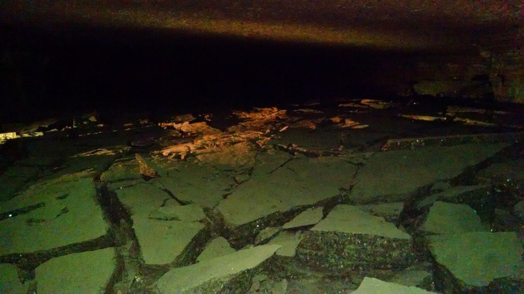 Despite the strategically placed pillars, the 650 feet of ground above the mine does place a bit of pressure on the existing ceiling and floor. Slowly, overtime, corridors of the once active mine have shown "wear and tear" with what are known as "ceiling sags" and "floor heaves." These formations occur very slowly and are monitored and secured regularly. Thus, they do not pose a danger to workers or visitors.