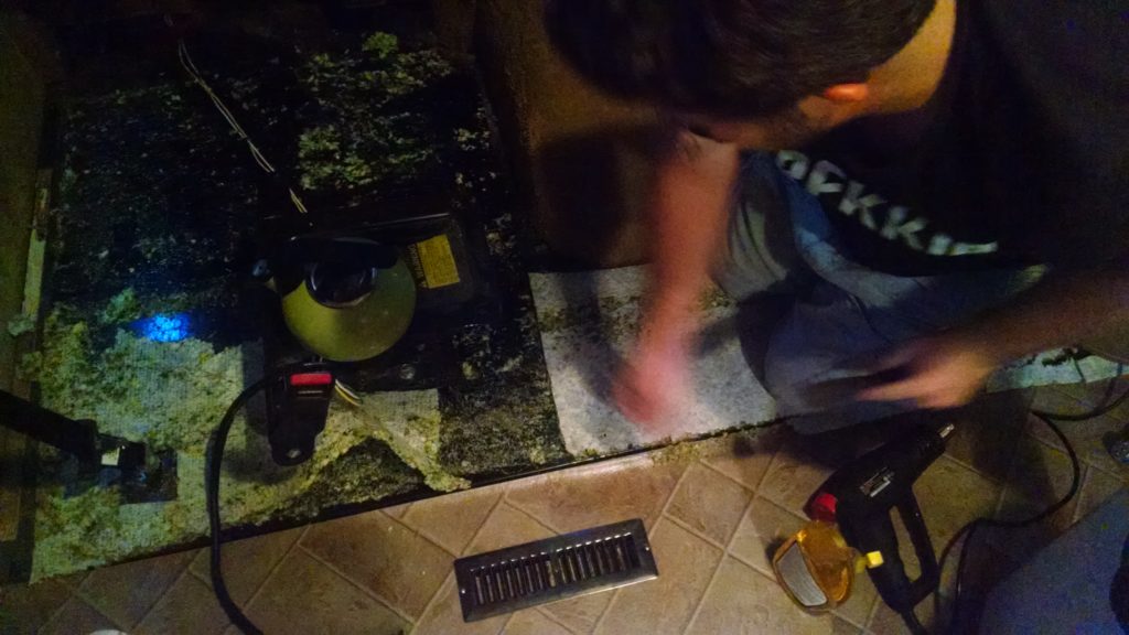 Whoever installed the original carpet had a field day with the adhesive. We were able to pick up most of the foam with a combination of a heat gun, boiling water, adhesive weakener spray, and a metal putty knife.